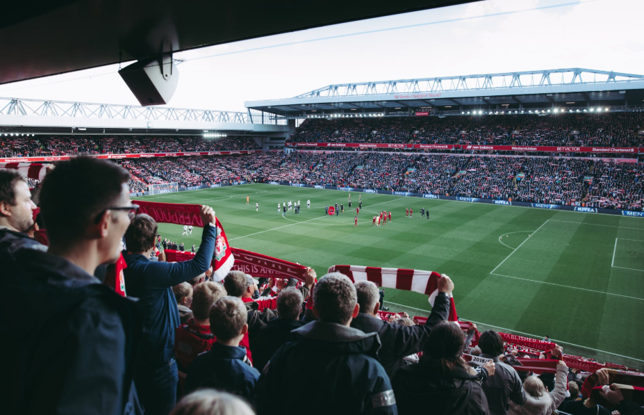 soccer field, players, and audience